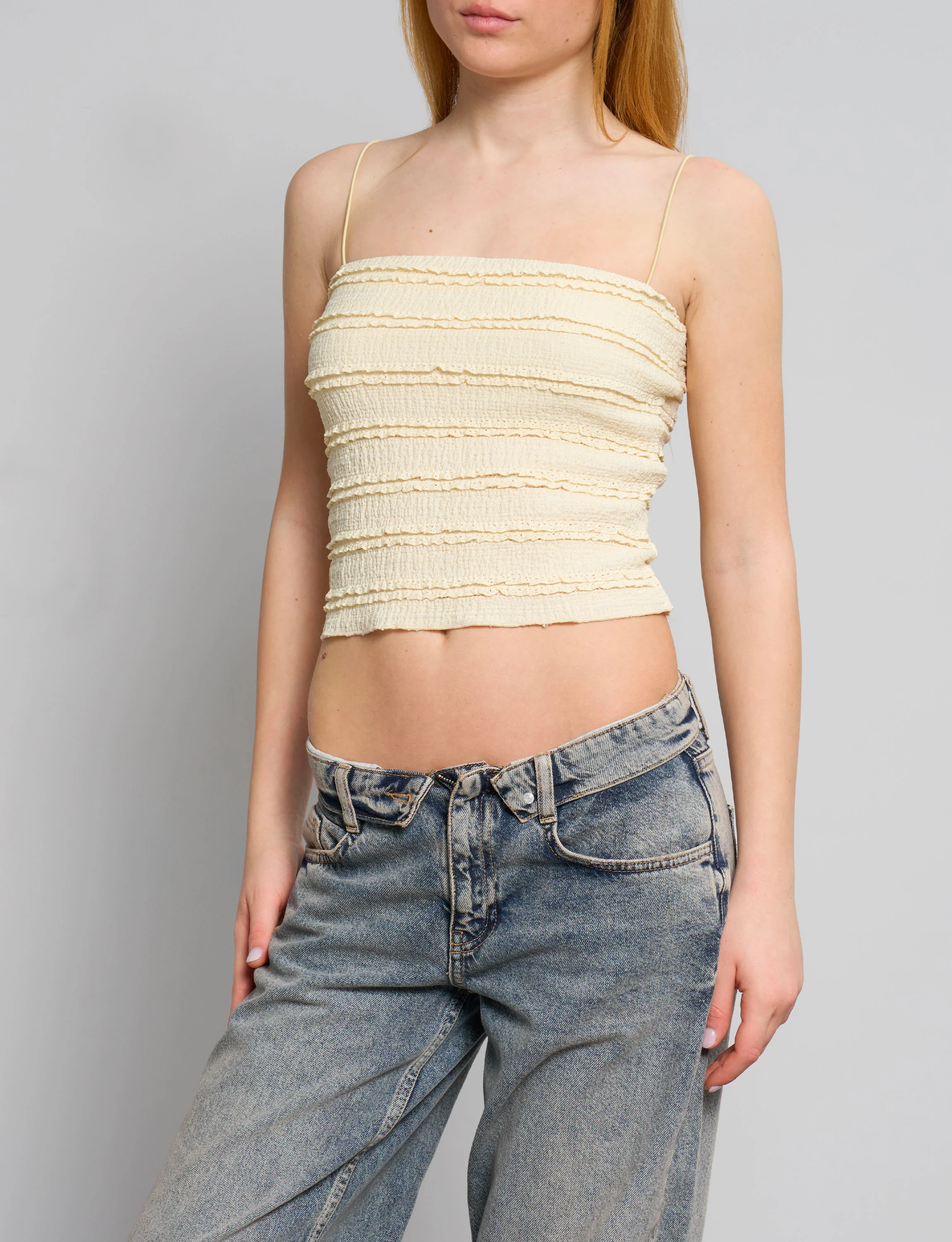 Top a fascia giallo pastello con rouches